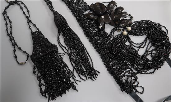 Four assorted French jet long necklaces and a bracelet.